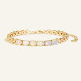 Watch Chain Opal Bracelet, resting on a warm linen background
