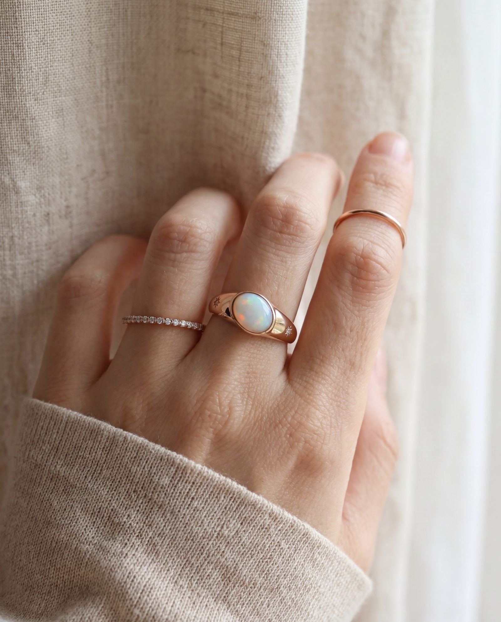 Supernova Signet Opal Ring in rose gold, worn on a model