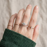 Trilogy Moissanite Ring | Elate in rose gold, worn on a model