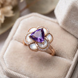 Extreme macro detail of the Violet Grande Bloom Ring in Rose Gold, showing the clarity of the 8mm trillion amethyst and pearl texture.