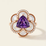 Violet Grande Bloom Ring in 18k Rose Gold showing 8mm trillion-cut amethyst and carved mother of pearl petals on a white background.