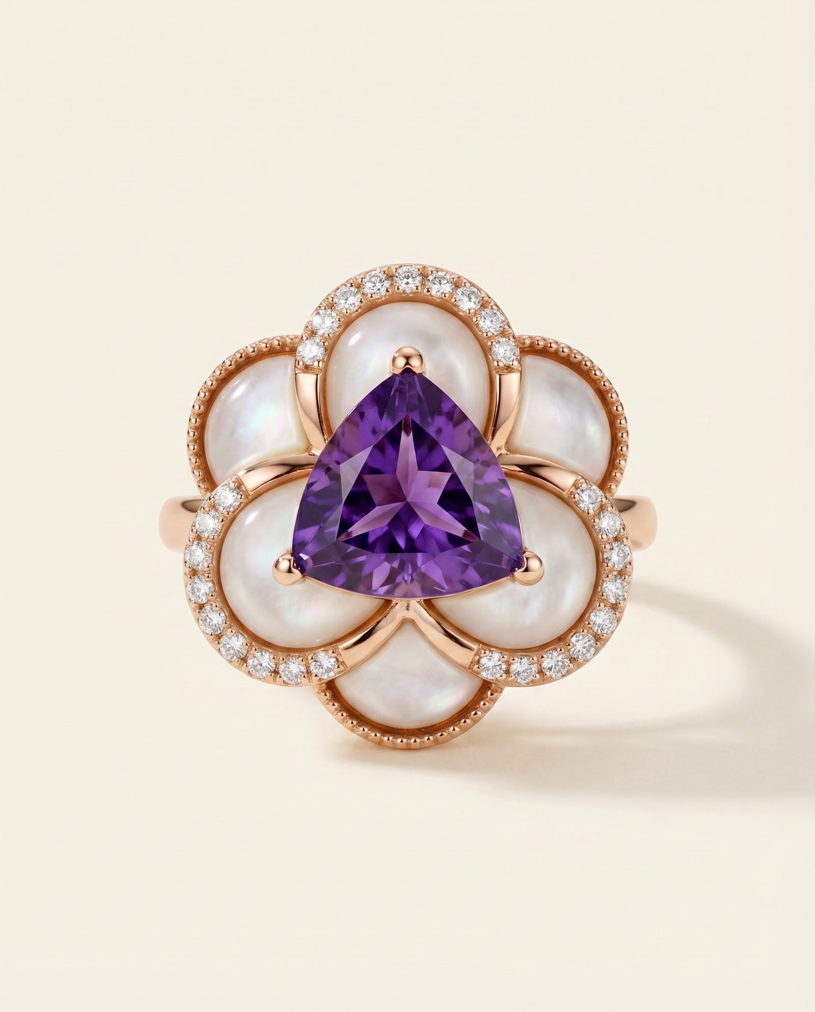 Violet Grande Bloom Ring in 18k Rose Gold showing 8mm trillion-cut amethyst and carved mother of pearl petals on a white background.