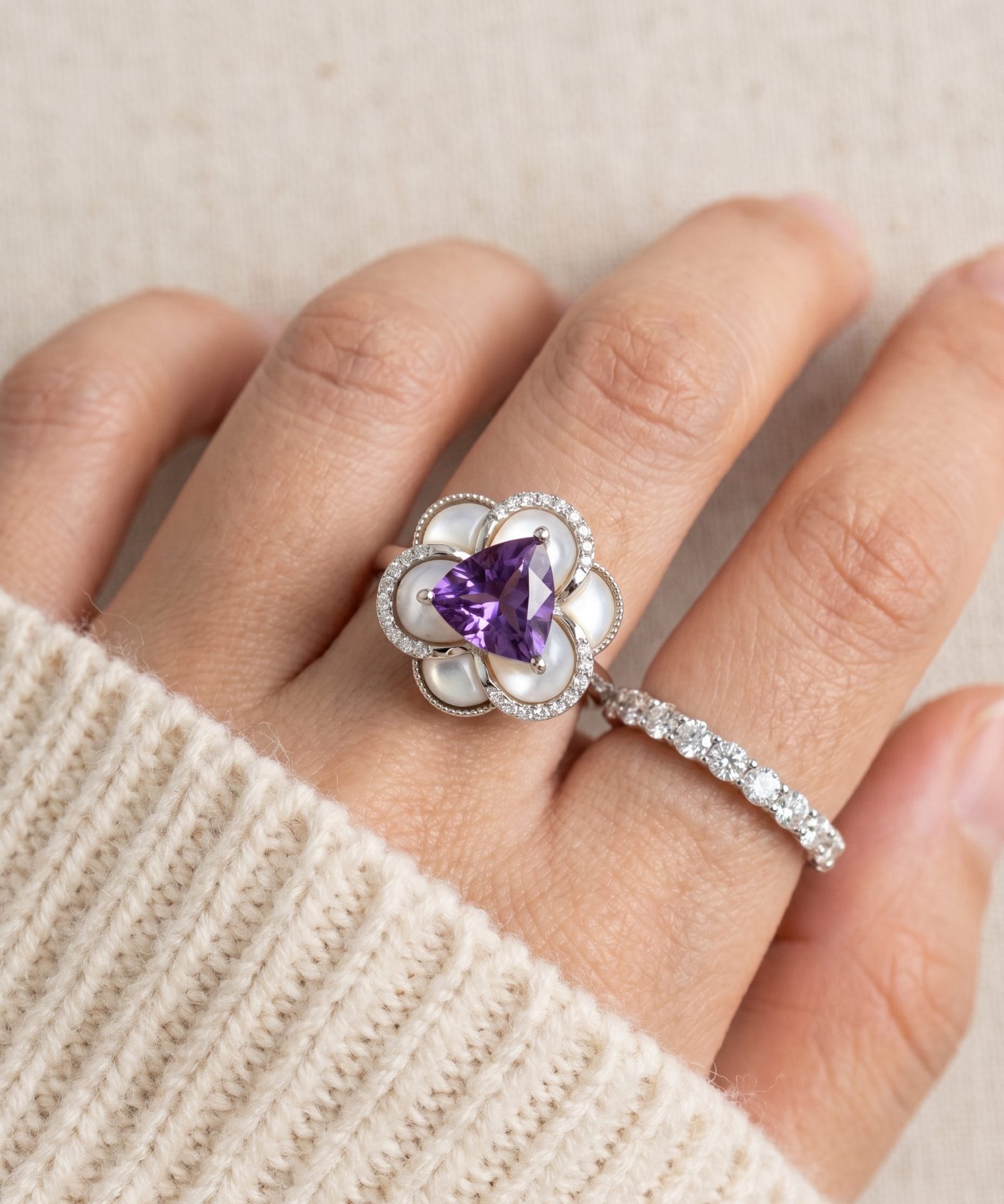 Violet Grande Bloom Ring in Silver styled on hand next to a diamond band to show high-end statement layering.