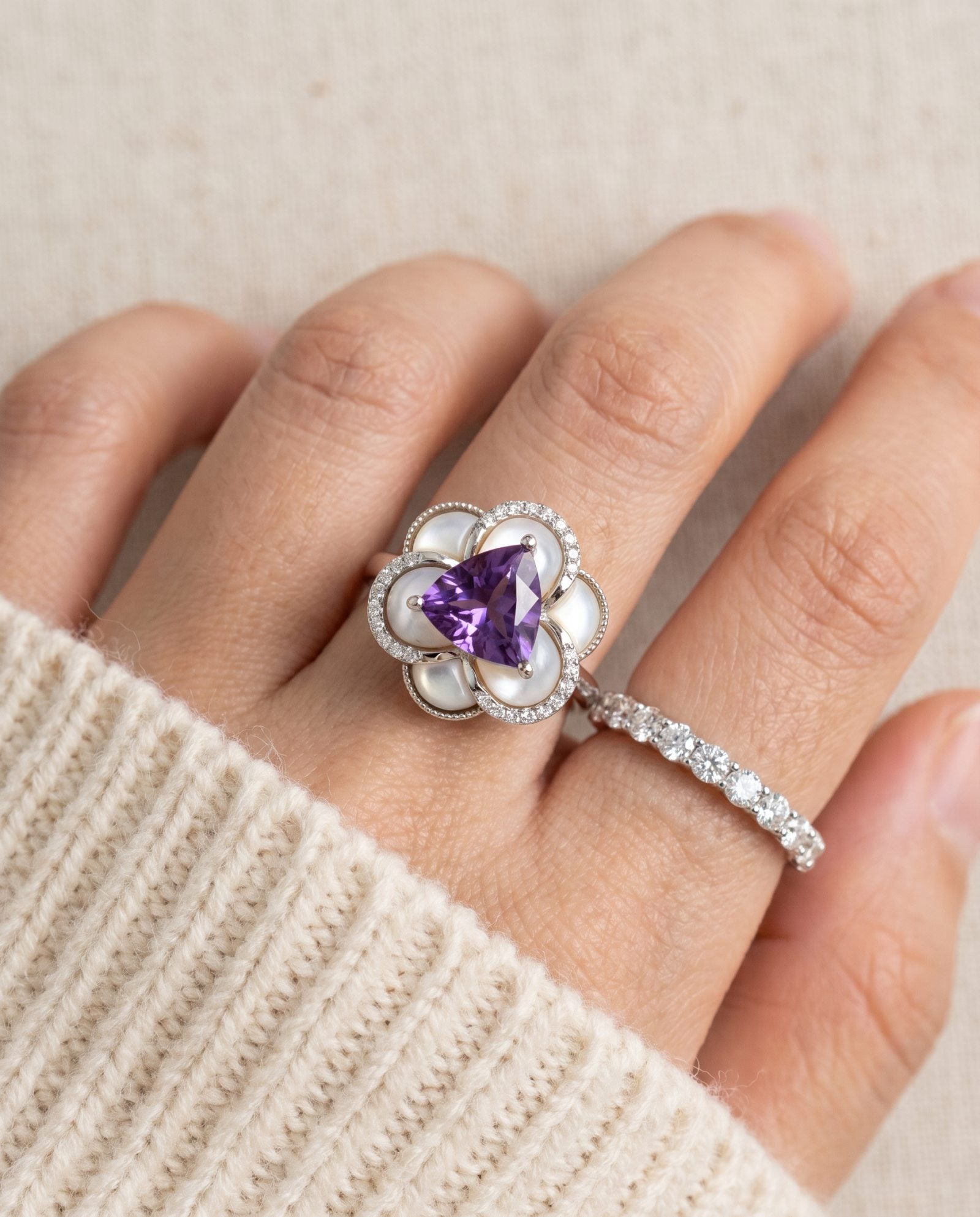Violet Grande Bloom Ring in Silver styled on hand next to a diamond band to show high-end statement layering.