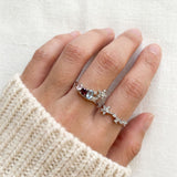 Lifestyle view of the Wildflower Nest ring set on a hand, styled as a sentimental push present for new mothers.