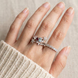 Lifestyle view of the Wildflower Nest ring set on a hand, styled as a sentimental push present for new mothers.