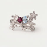 Wildflower Nest two-piece stacking ring set in silver featuring oval-cut Rose Quartz, Rhodolite, and Sky Blue Topaz gemstones.
