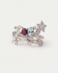 Wildflower Nest two-piece stacking ring set in silver featuring oval-cut Rose Quartz, Rhodolite, and Sky Blue Topaz gemstones.
