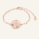 Close-up of the Winterscape Mother of Pearl Bracelet in rose gold, resting on a warm linen background