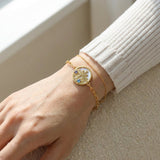Winterscape Mother of Pearl Bracelet in yellow gold, worn on a model