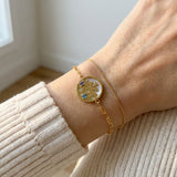 Winterscape Mother of Pearl Bracelet in yellow gold, worn on a model