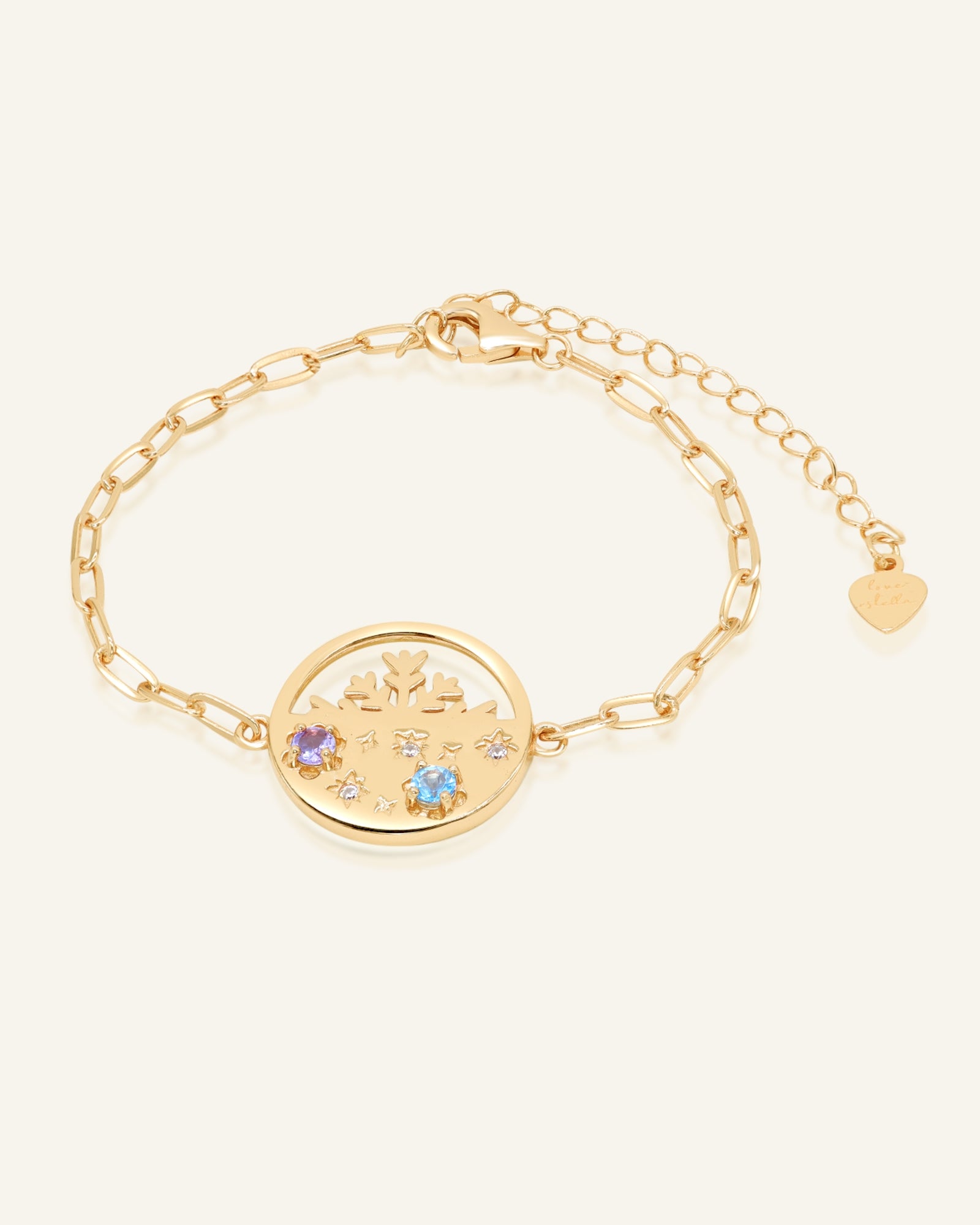 Winterscape Mother of Pearl Bracelet in yellow gold, resting on a warm linen background