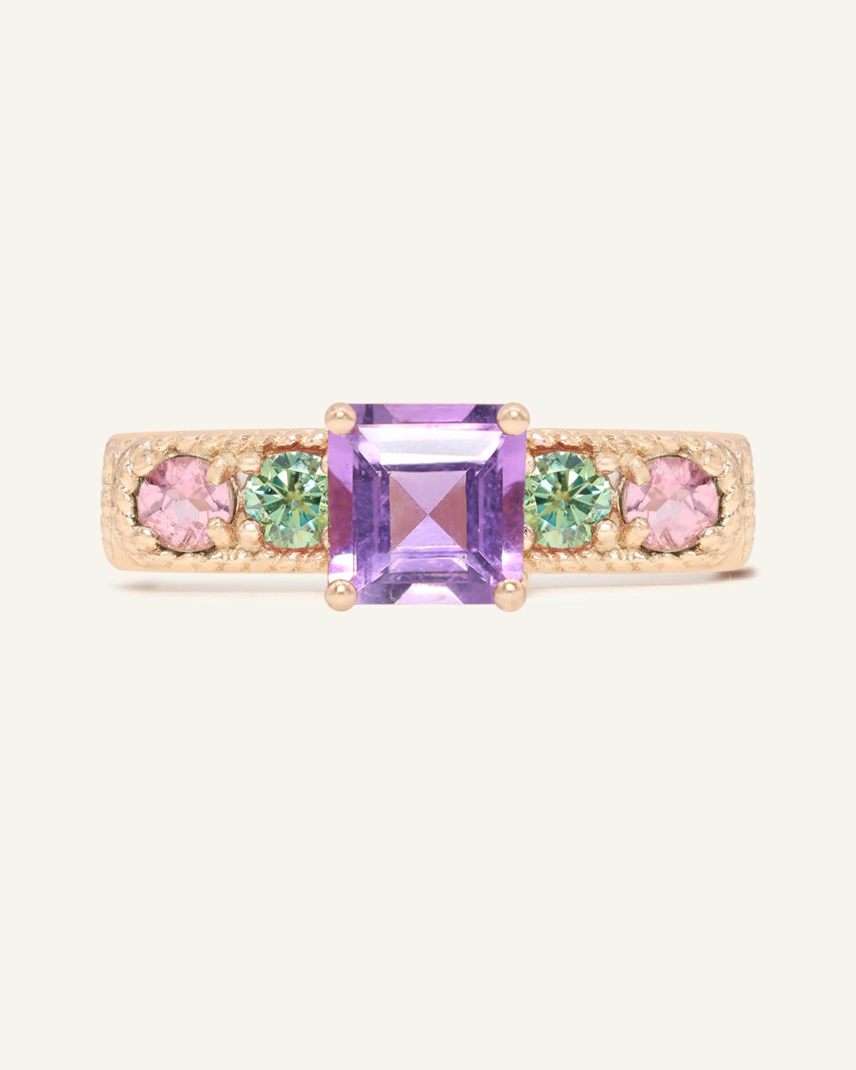Arc de Triomphe Amethyst Ring in rose gold, front view of the amethyst and colourful gemstone band on warm ivory