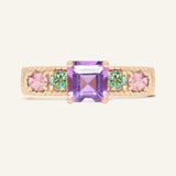 Arc de Triomphe Amethyst Ring in rose gold, front view of the amethyst and colourful gemstone band on warm ivory