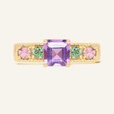 Arc de Triomphe Amethyst Ring in yellow gold, front view of the amethyst and colourful gemstone band on warm ivory