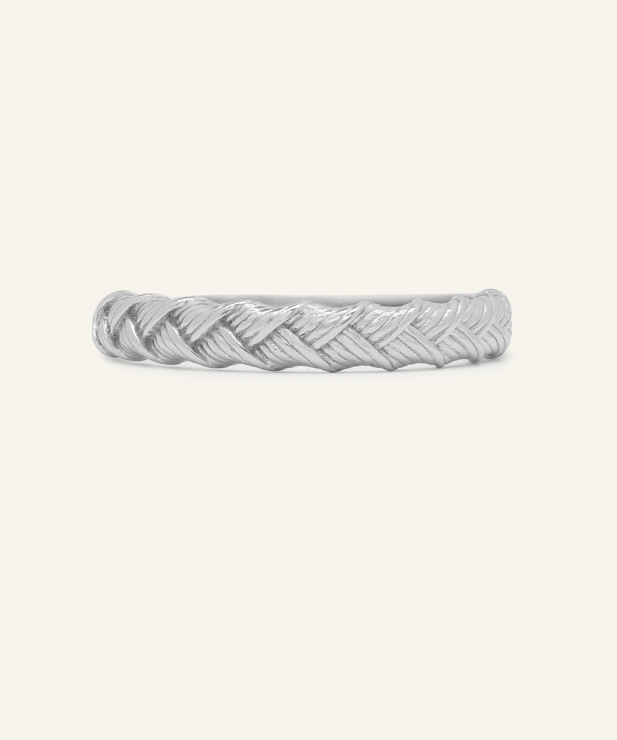 Braided Bliss Band in silver, front view of the textured braided band on warm ivory