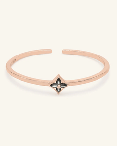 Clover Monogram Cuff | Black Mother of Pearl, resting on a warm linen background
