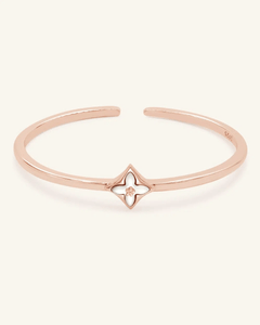 Clover Monogram Cuff | White Mother of Pearl, Elate, resting on a warm linen background