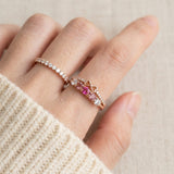 Pink gemstone double band bow ring styled on hand