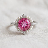 Duchess Pink Topaz Ring in silver with vivid natural pink topaz, faux pearl halo and CZ accents
