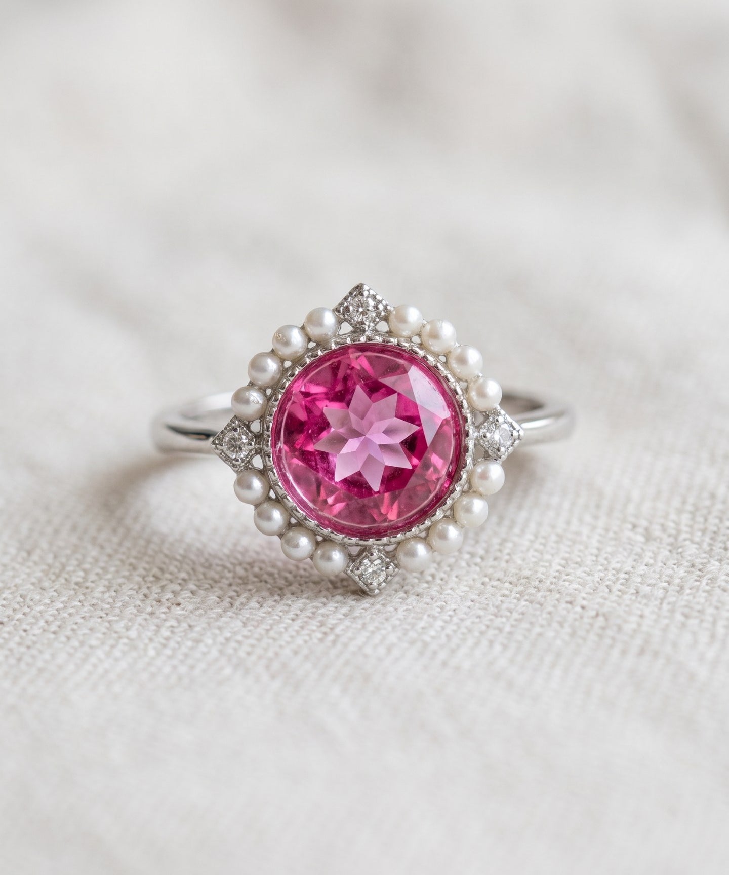 Duchess Pink Topaz Ring in silver with vivid natural pink topaz, faux pearl halo and CZ accents