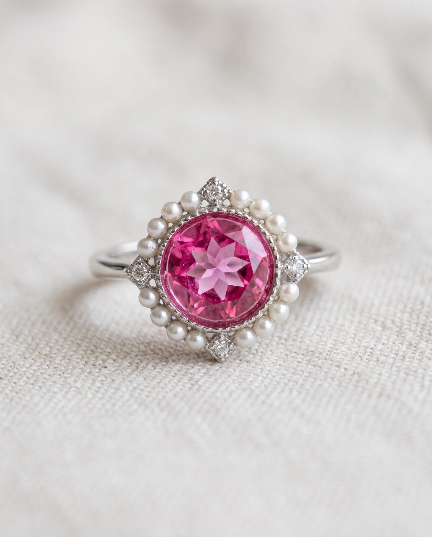 Duchess Pink Topaz Ring in silver with vivid natural pink topaz, faux pearl halo and CZ accents