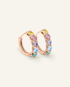 Entwine Huggies styled alongside complementary everyday earrings