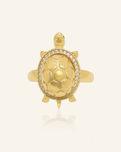 Close-up of the Golden Turtle Citrine Ring, resting on a warm linen background
