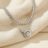Silver interlocking rings moissanite necklace styled with a tennis necklace