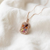 Jewel Box Multi-Gemstone Necklace in rose gold, close-up on soft ivory fabric