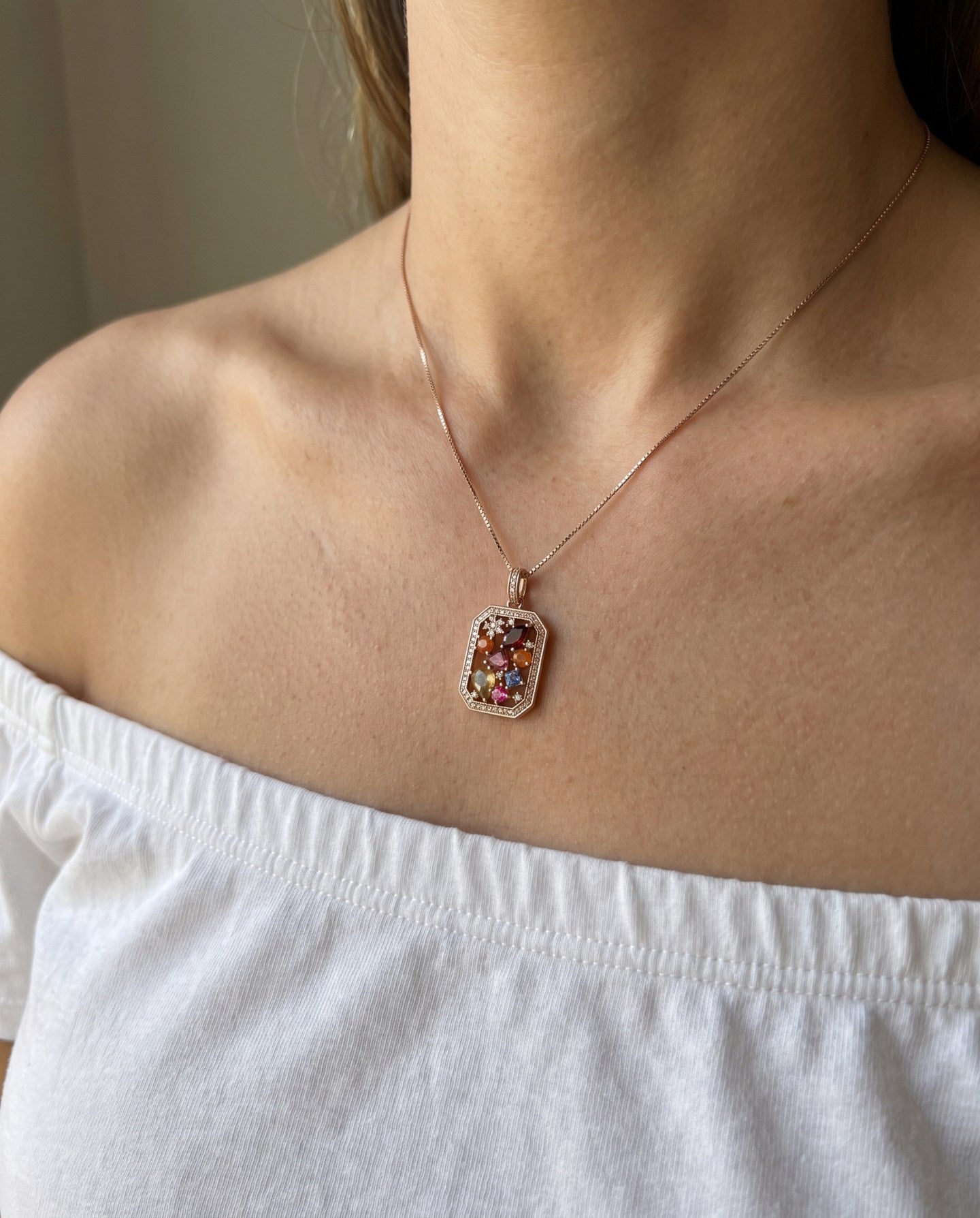 Jewel Box Multi-Gemstone Necklace in rose gold, worn with a white neckline