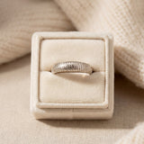 Linear Stripes Band in silver, displayed upright in a cream ring box