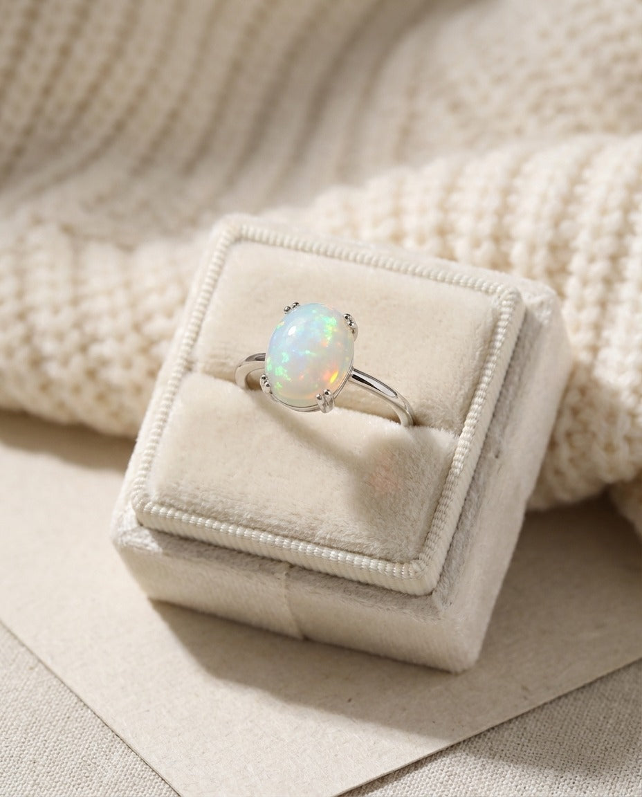 Luna Ethiopian Opal Ring in silver, displayed upright in a cream ring box