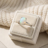 Luna Ethiopian Opal Ring in silver, displayed upright in a cream ring box
