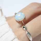 Luna Ethiopian Opal Ring in silver, close-up of the opal worn on a hand in daylight
