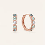 Pair of mint ombré moissanite hoop earrings in rose gold on an ivory background
