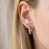 Side view of mint ombré moissanite rose gold hoop earring on the ear