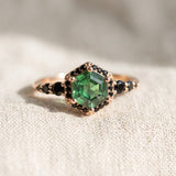 Nocturne Halo Hexagon Ring in yellow gold, lab-grown alexandrite showing green tones with a black CZ halo