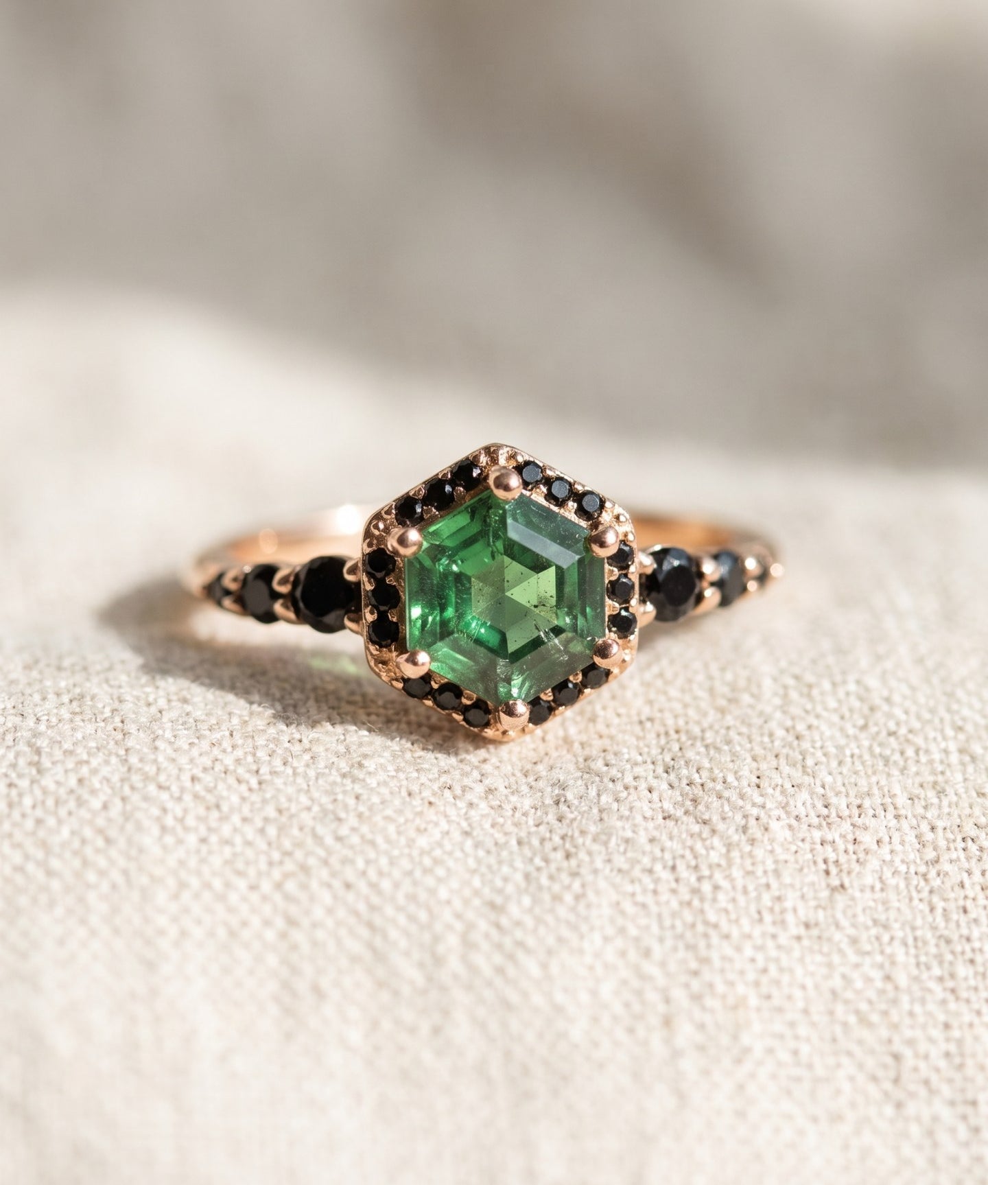 Nocturne Halo Hexagon Ring in yellow gold, lab-grown alexandrite showing green tones with a black CZ halo