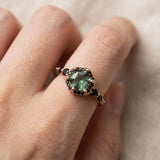 Nocturne Halo Hexagon Ring in yellow gold, lab-grown alexandrite showing green tones with a black CZ halo