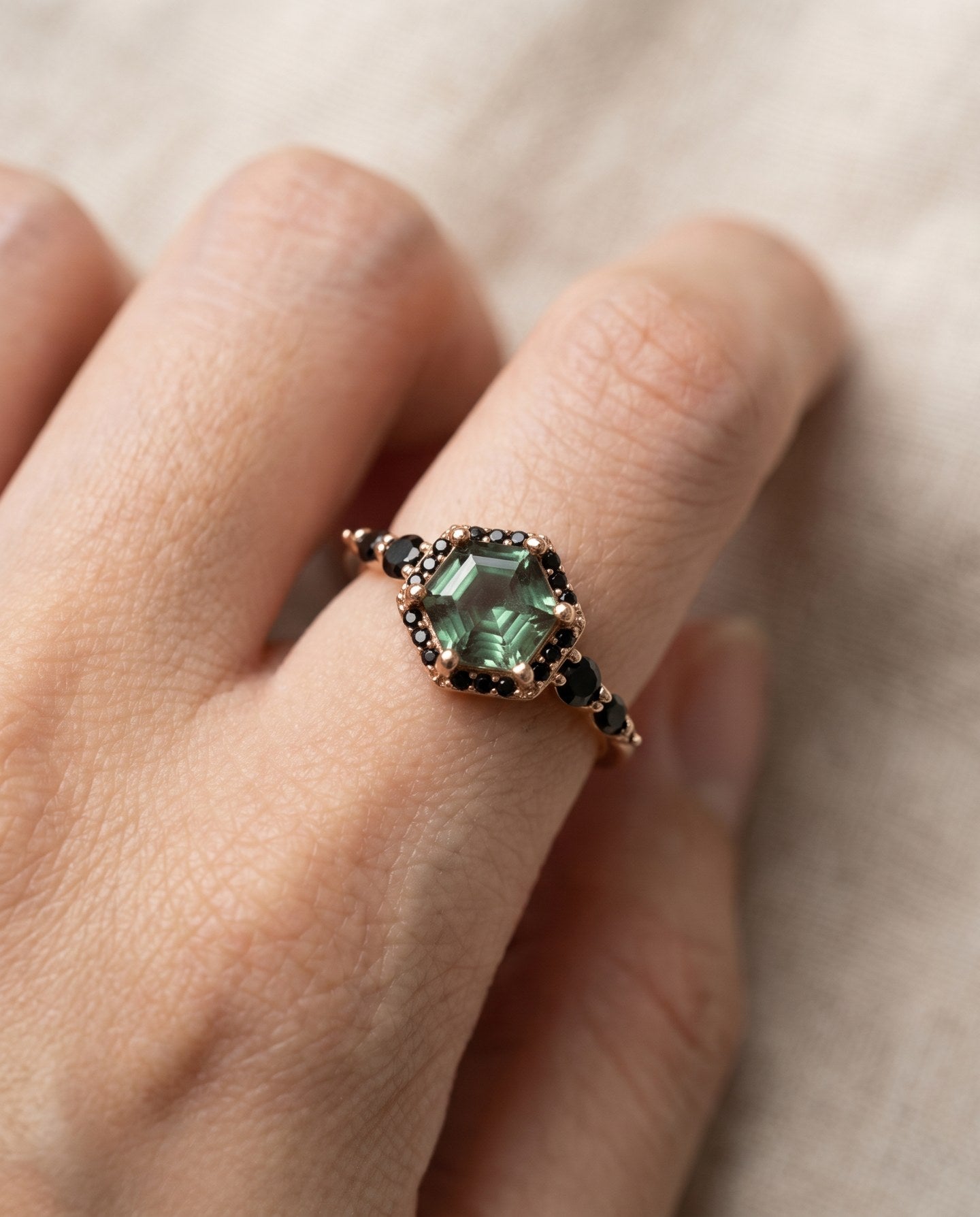 Nocturne Halo Hexagon Ring in yellow gold, lab-grown alexandrite showing green tones with a black CZ halo