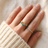 Papillon Butterfly Meadow Ring in rose gold with peridot and blue topaz butterflies worn on the hand