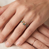 Papillon Butterfly Meadow Ring in rose gold with peridot and blue topaz butterflies worn on the hand