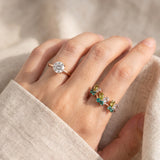 Papillon Butterfly Meadow Ring in yellow gold with peridot and blue topaz butterflies worn on the hand
