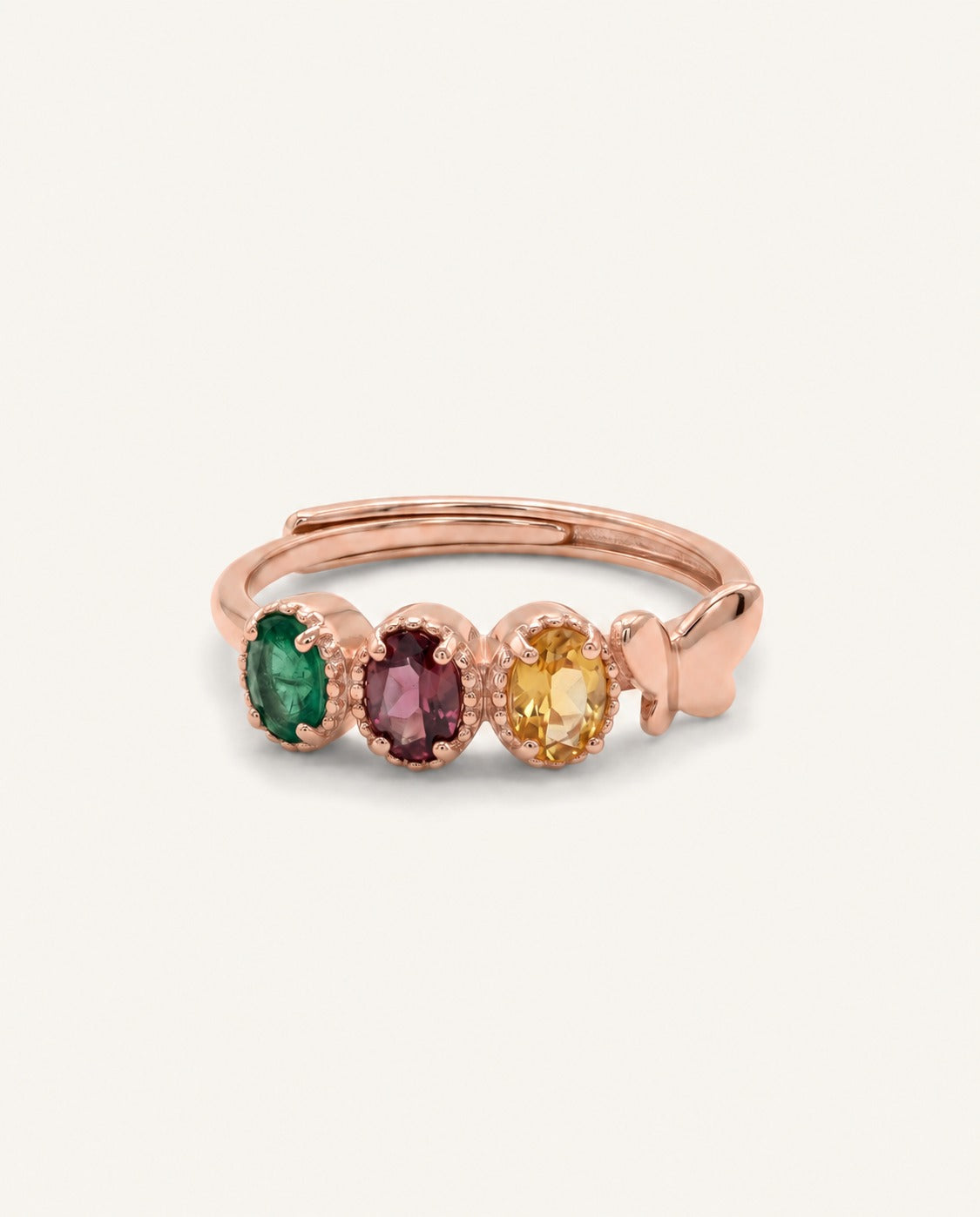 Papillon Trio Gemstone Ring in rose gold with three oval gemstones and a butterfly detail on warm ivory