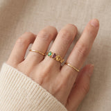 Papillon Trio Gemstone Ring in rose gold, worn gold stack