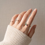 Papillon Trio Gemstone Ring in rose gold, worn knit sleeve