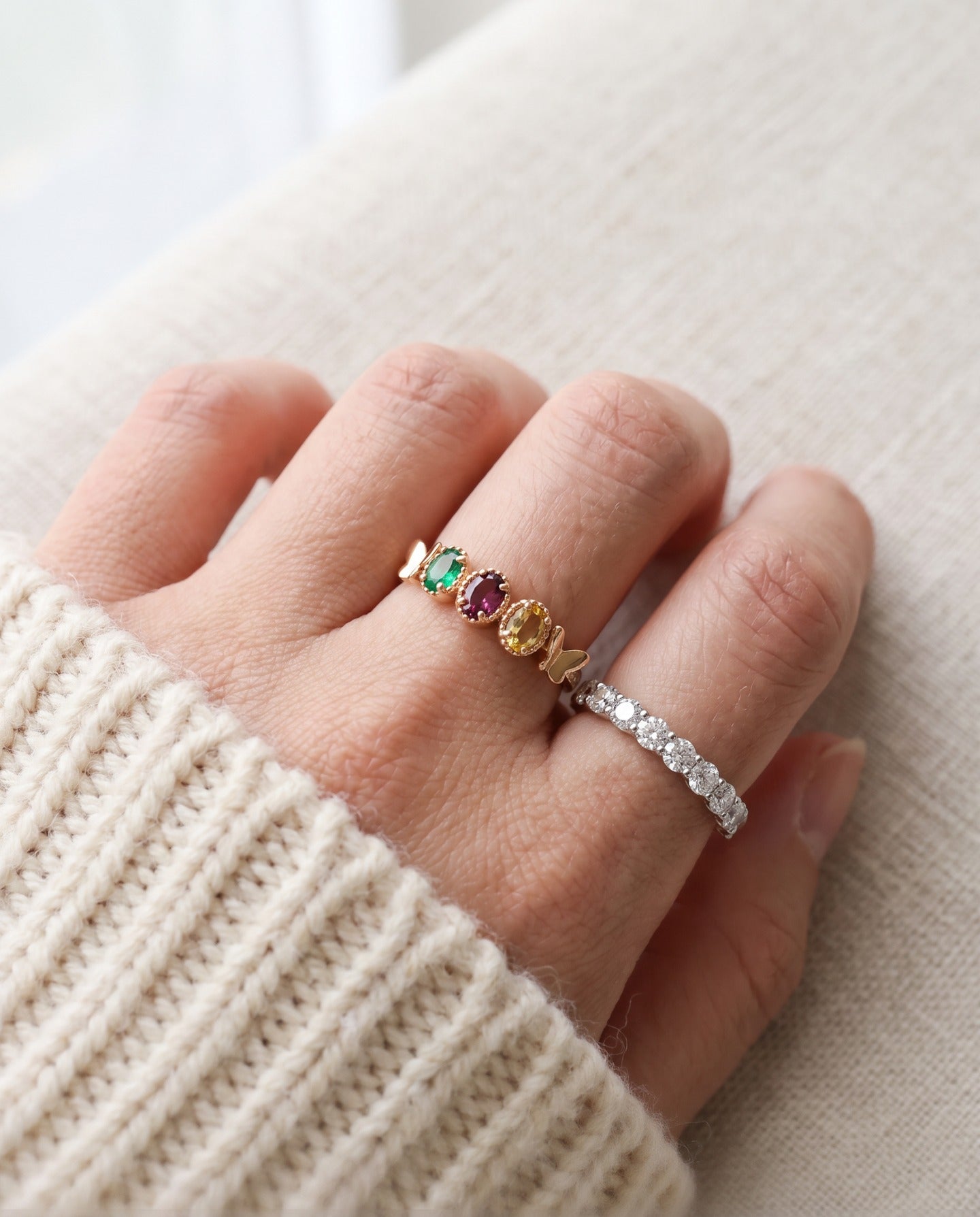 Papillon Trio Gemstone Ring in rose gold, worn pearl stack