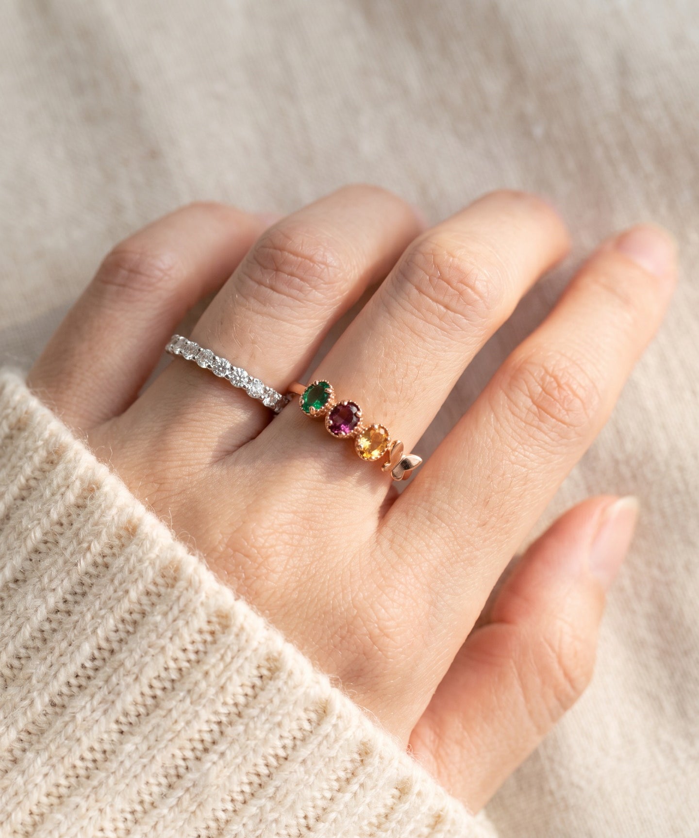 Papillon Trio Gemstone Ring in rose gold, worn stack closeup