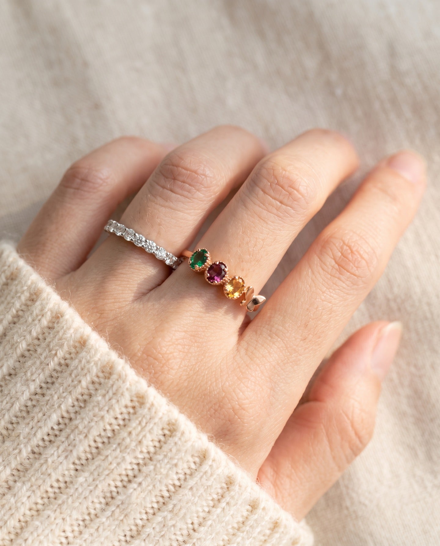 Papillon Trio Gemstone Ring in rose gold, worn stack closeup